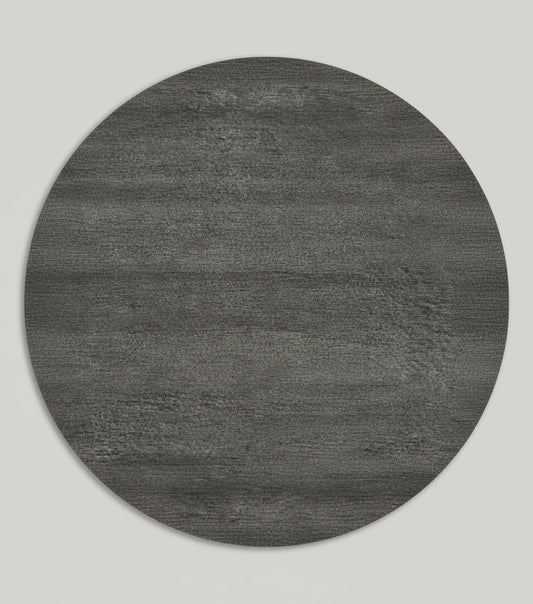 Charcoal grey round hand-loom carpet made from premium New Zealand wool on neutral background